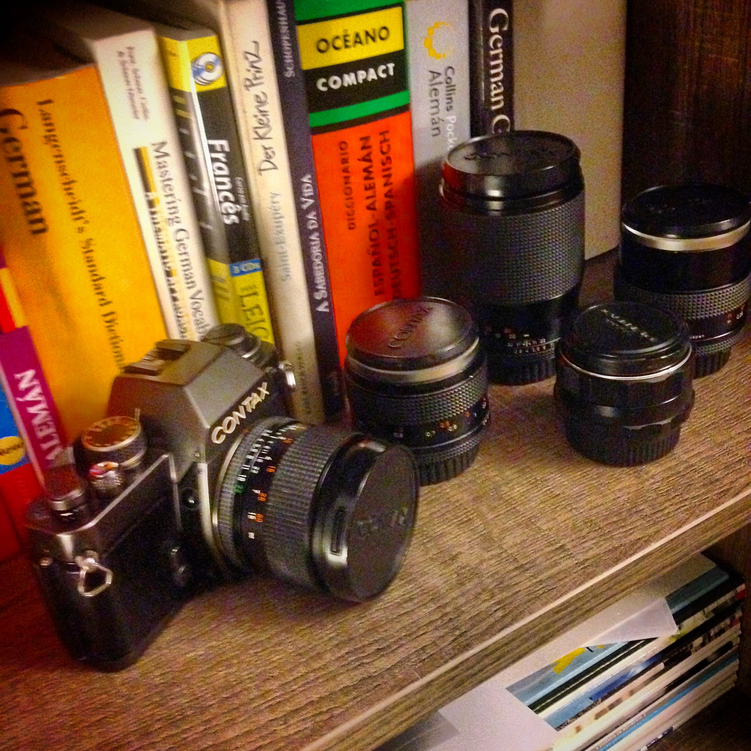 Contax film camera on shelf alongside German dictionaries, Der Kleine Prinz and Schopenhauer